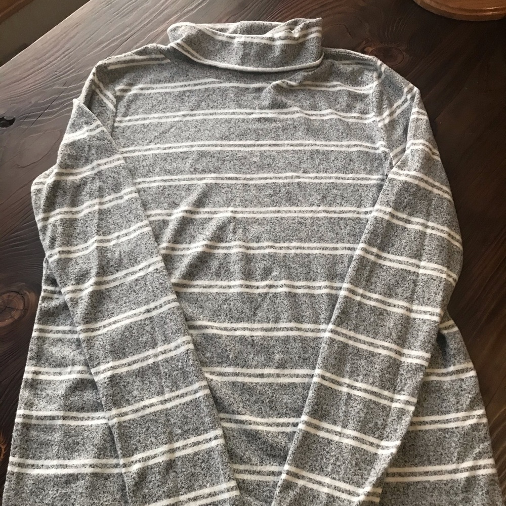 Caution to the wind turtleneck
